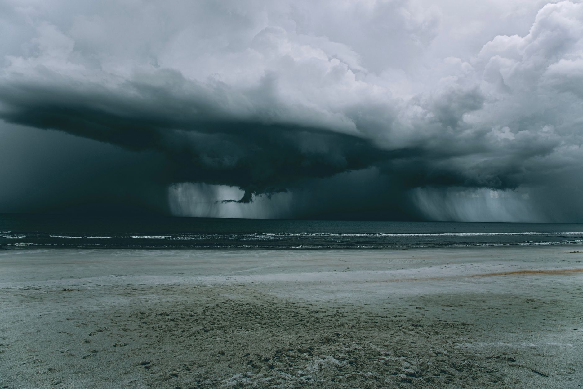a beach under gloomy sky